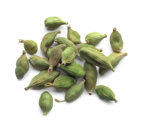Photo of Pile of dry green cardamom pods on white background, top view