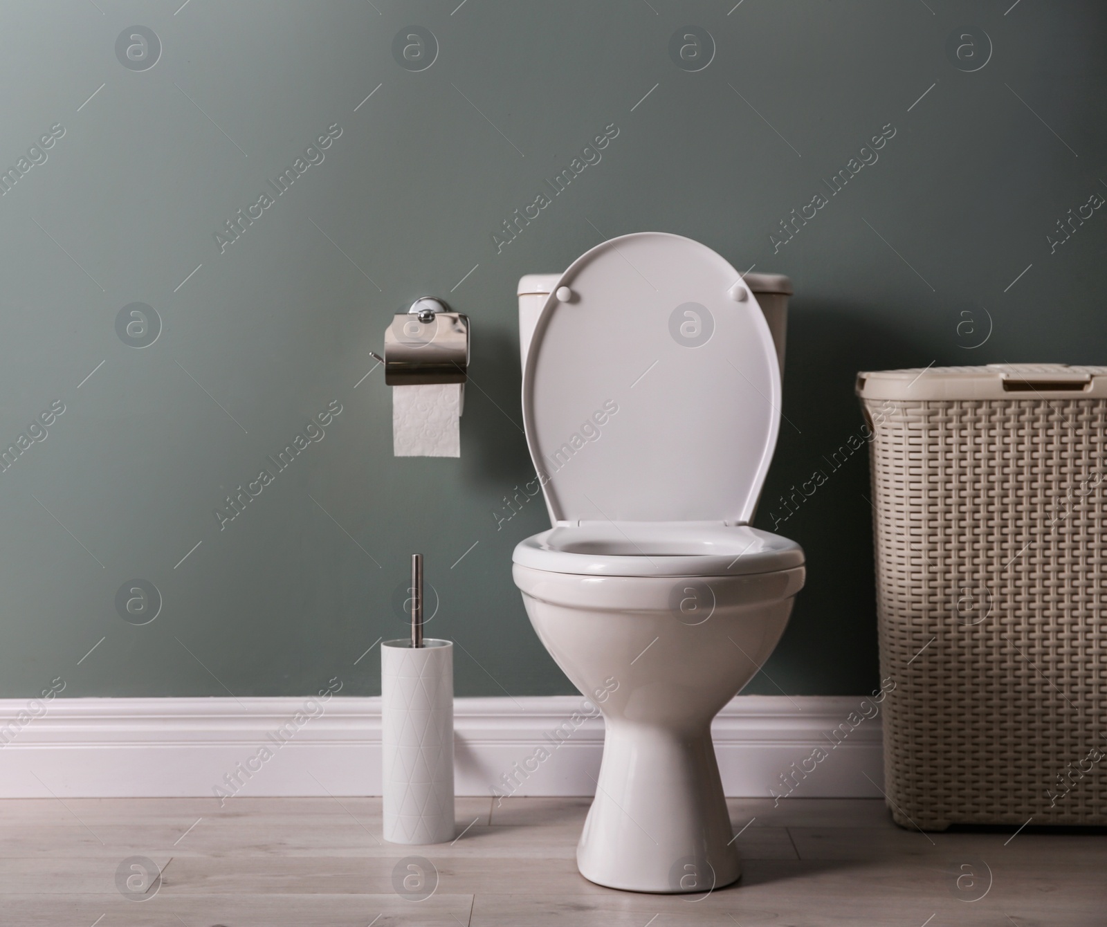 Photo of New ceramic toilet bowl in modern bathroom