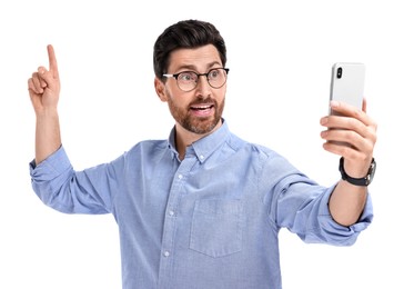 Photo of Man taking selfie with smartphone on white background