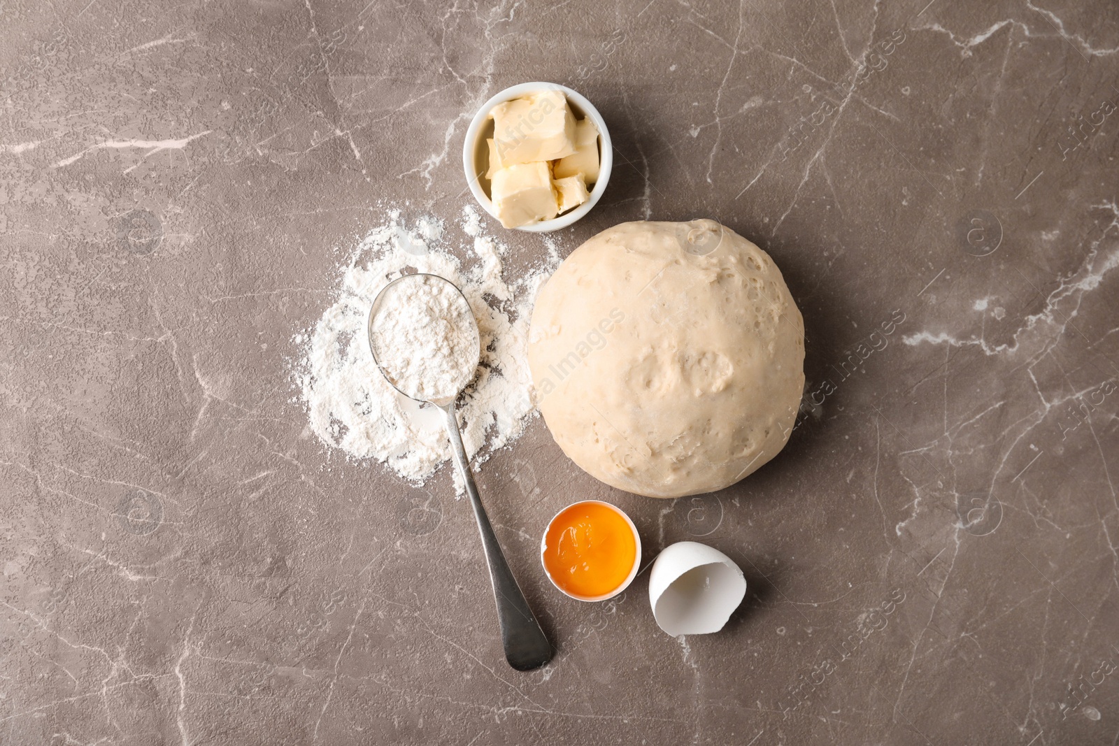 Photo of Flat lay composition with ingredients for pastries on marble table