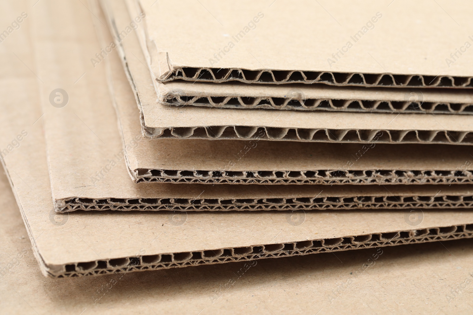 Photo of Sheets of brown corrugated cardboard, closeup view