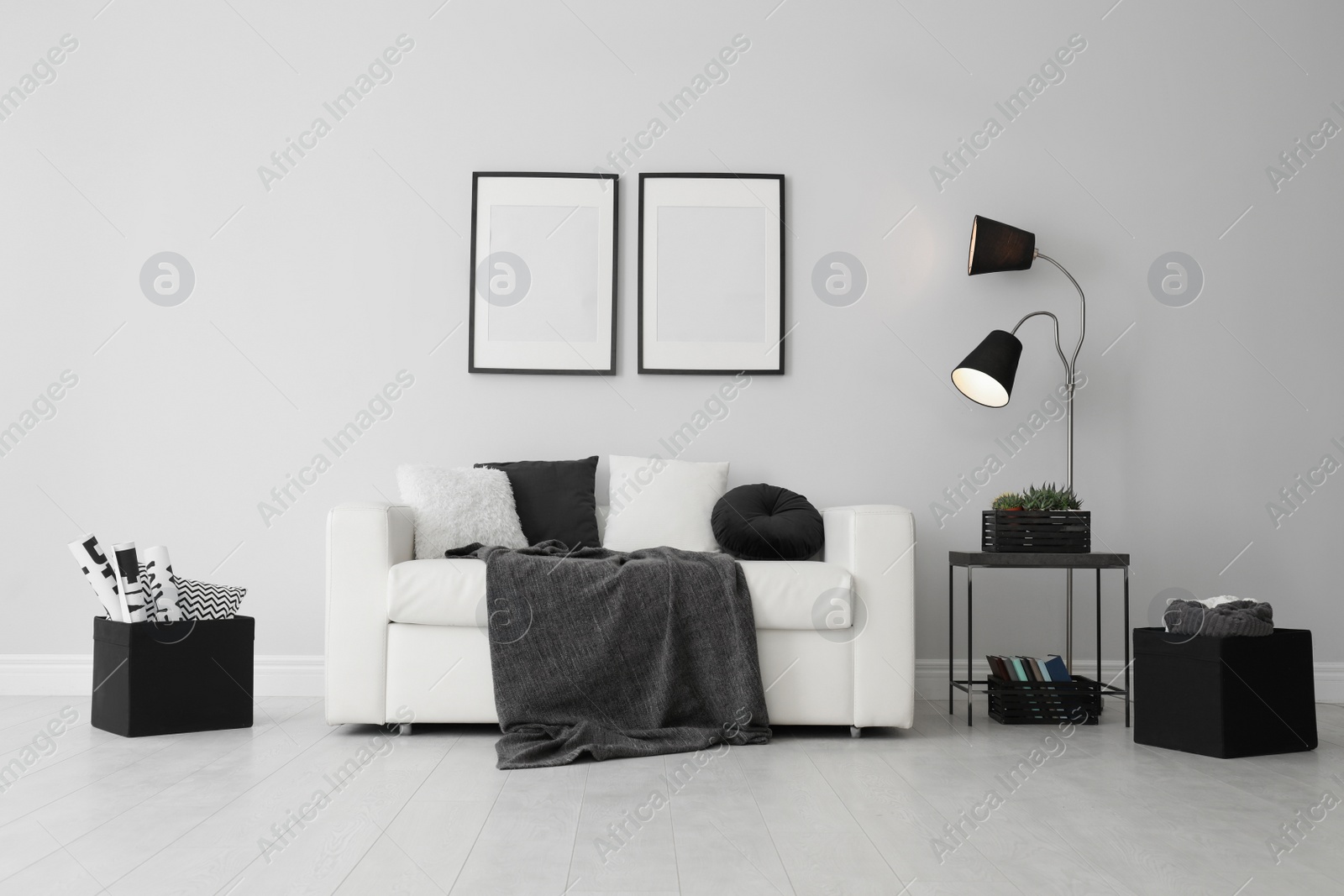 Photo of Elegant white sofa in modern living room interior