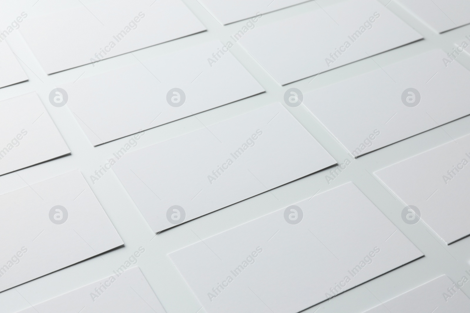 Photo of Blank business cards on white background, closeup. Mockup for design