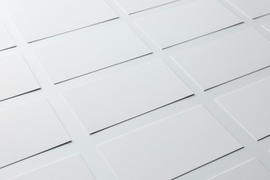 Photo of Blank business cards on white background, closeup. Mockup for design