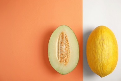 Photo of Flat lay composition with melons and space for text on color background