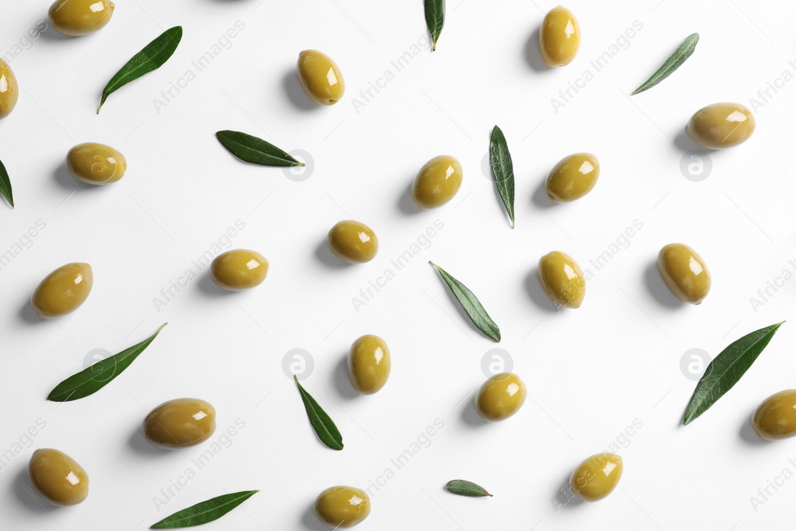 Photo of Flat lay composition with fresh olives covered with oil on white background