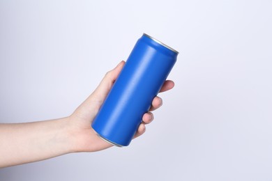 Photo of Woman with energy drink on light grey background, closeup