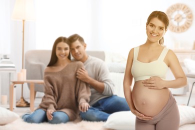 Surrogate mother and intended parents in room