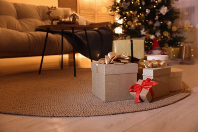 Beautiful gift boxes in room decorated for Christmas