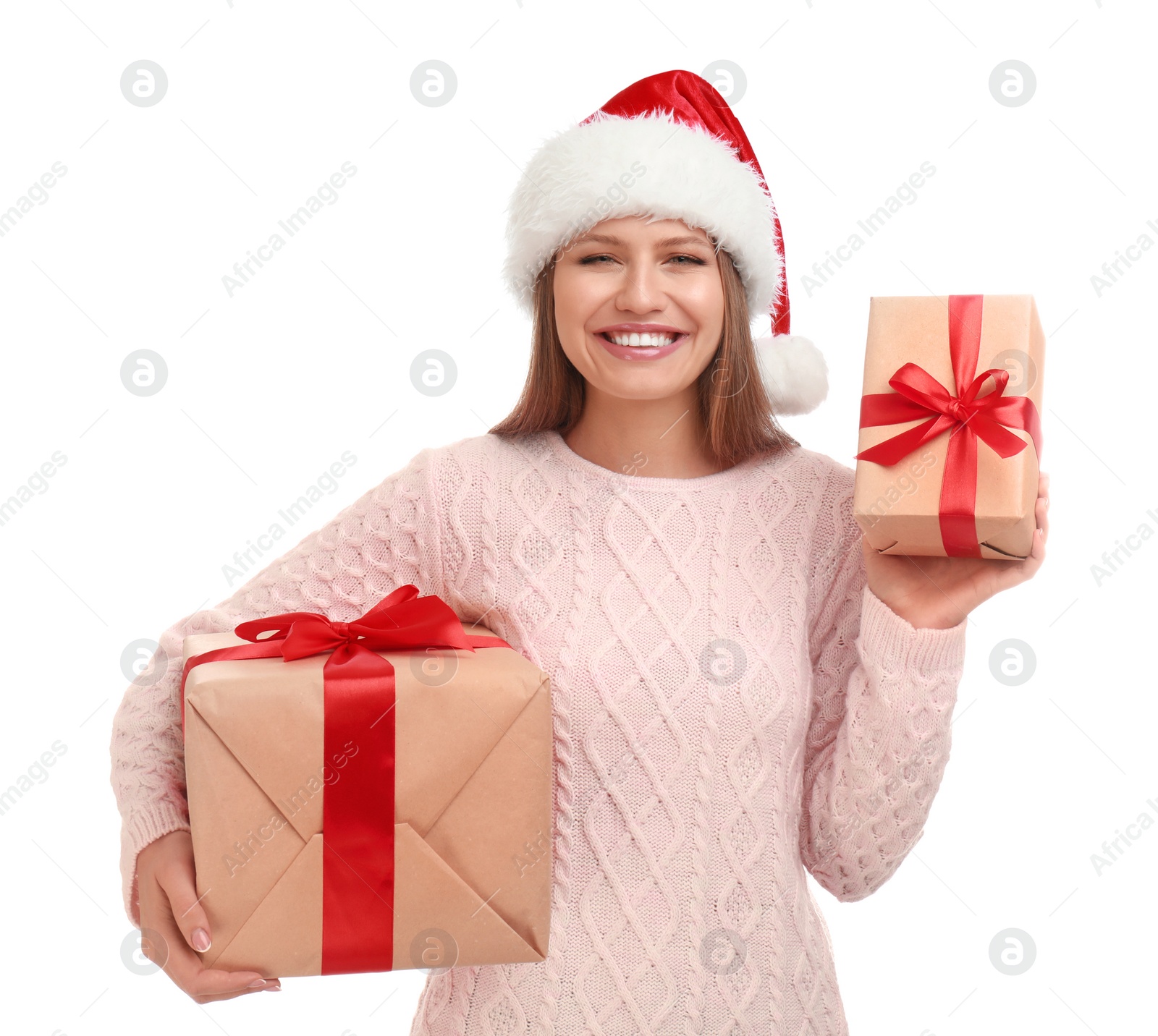 Photo of Happy young woman in Santa hat with Christmas gifts on white background