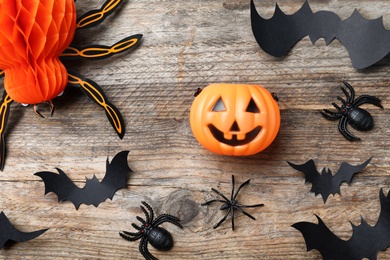 Halloween decor elements on wooden background, flat lay