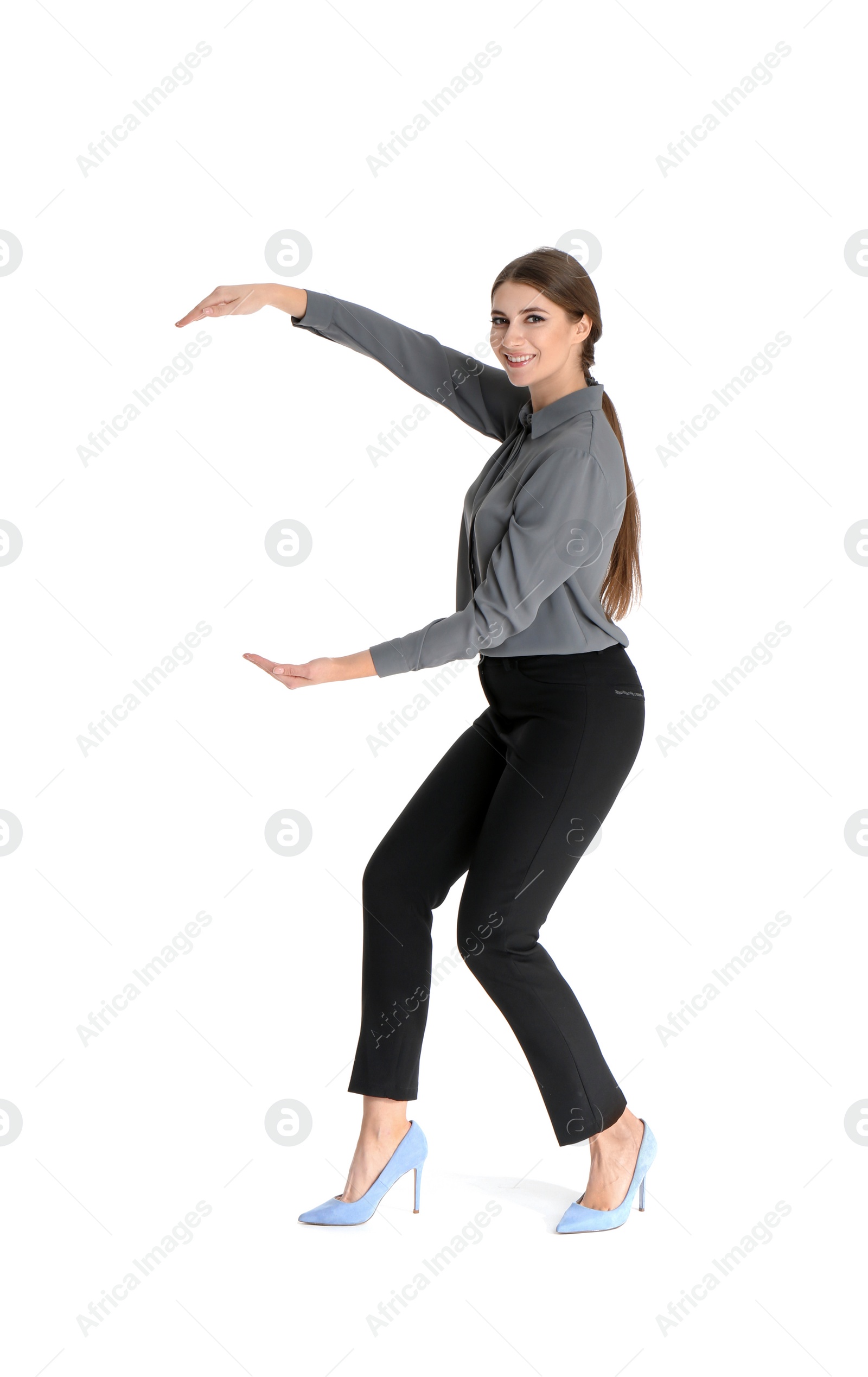 Photo of Young woman with magnet attracting people on white background