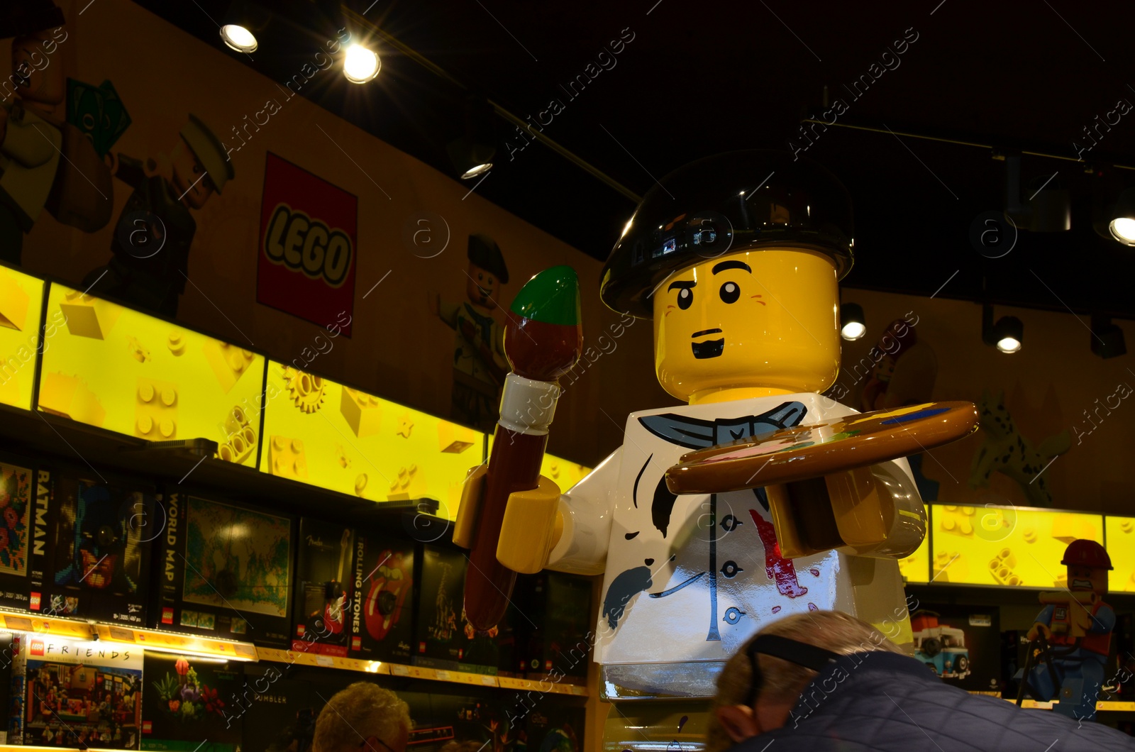 Photo of AMSTERDAM, NETHERLANDS - SEPTEMBER 10, 2022: Artist figure made with colorful Lego constructor indoors, space for text