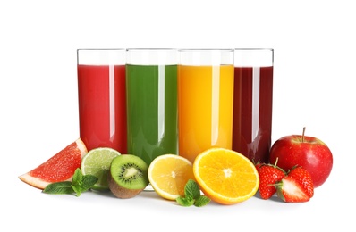 Glasses with different juices and fresh fruits on white background