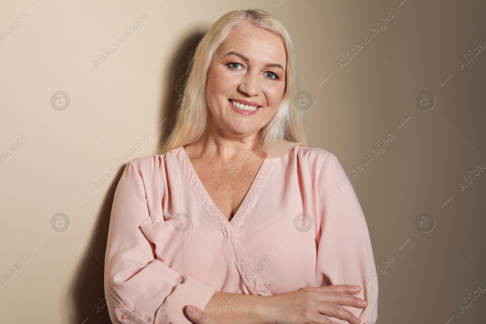 Photo of Portrait of mature woman on color background