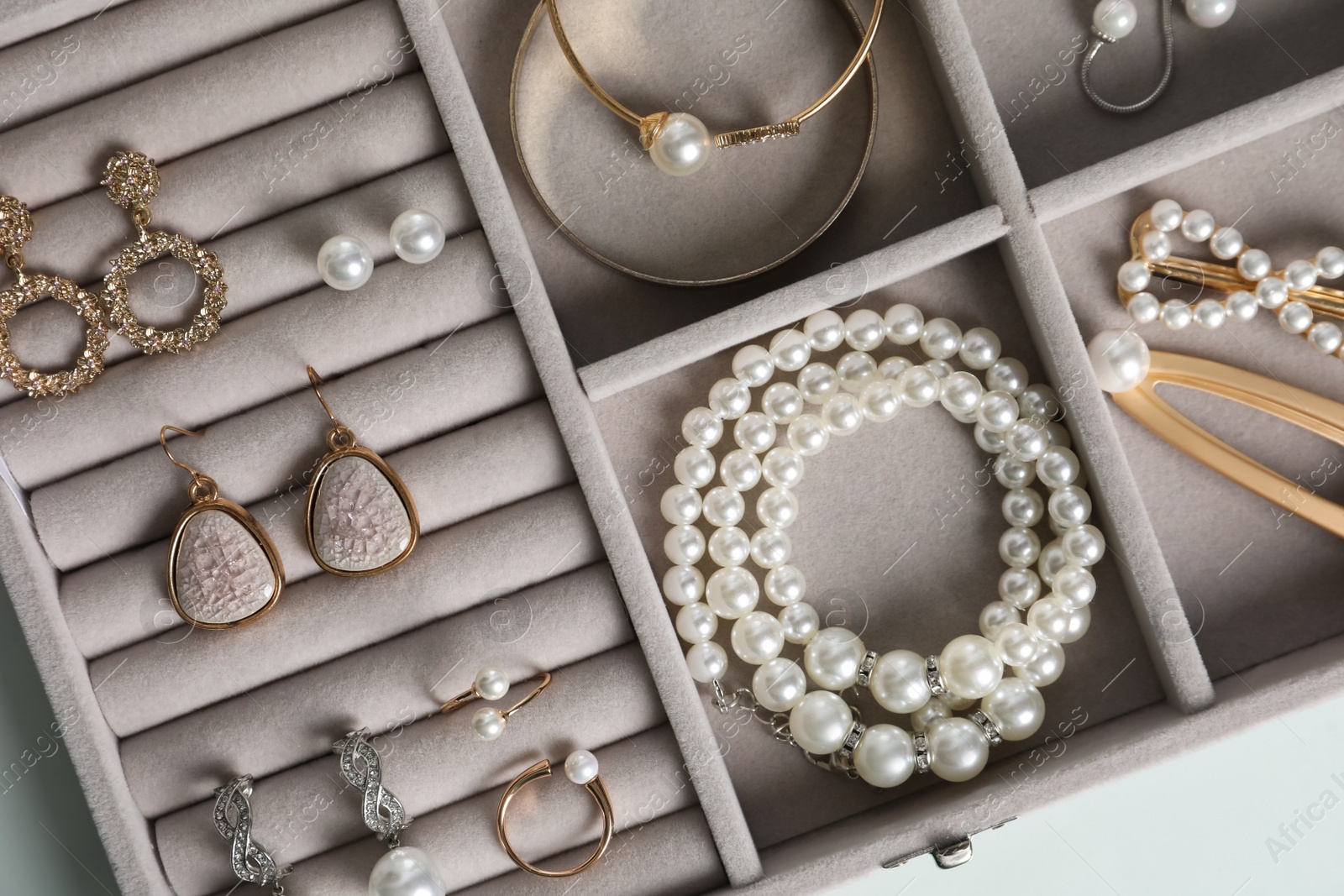 Photo of Box with luxurious pearl jewelry, top view