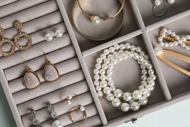 Photo of Box with luxurious pearl jewelry, top view