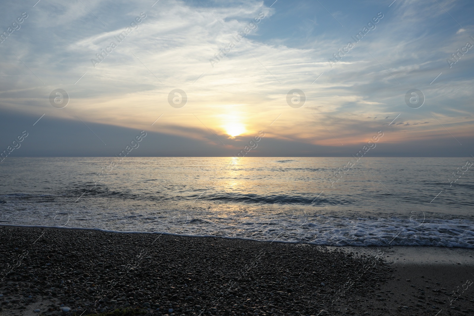 Photo of Picturesque view of sea and tropical beach at sunset