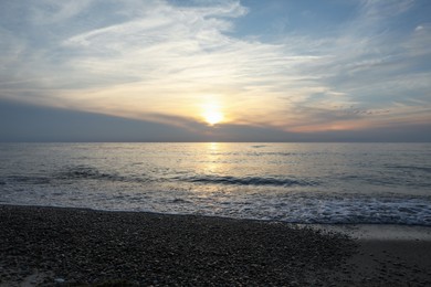 Picturesque view of sea and tropical beach at sunset