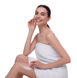 Photo of Beautiful woman with smear of body cream on her leg against white background