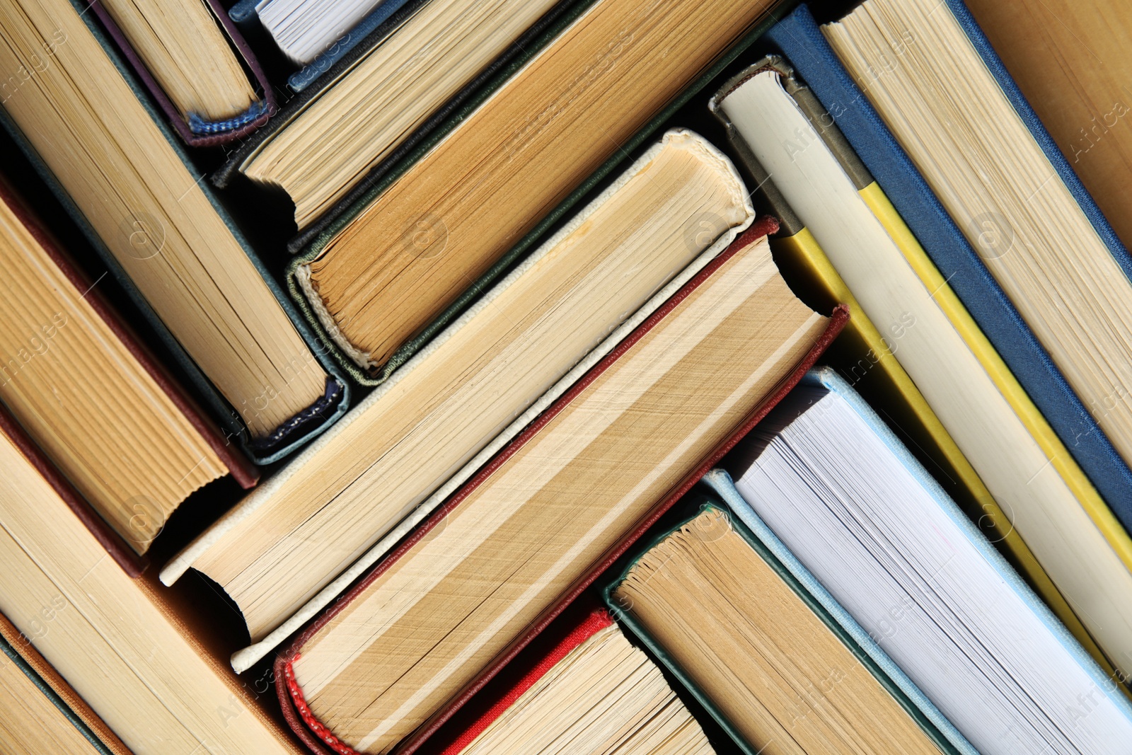 Photo of Many different hardcover books as background, top view