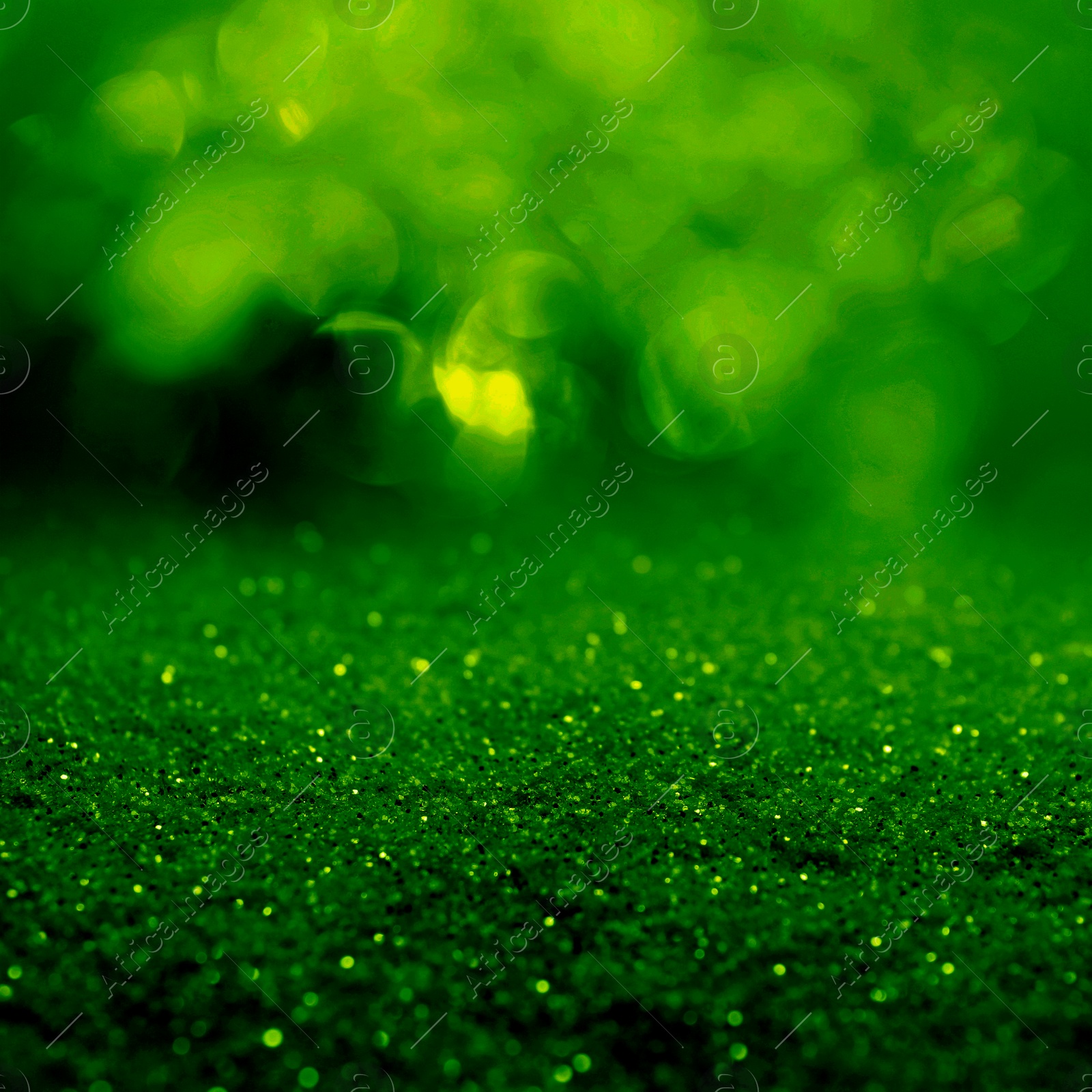 Image of St. Patrick day. Shiny green glitter, closeup. Bokeh effect