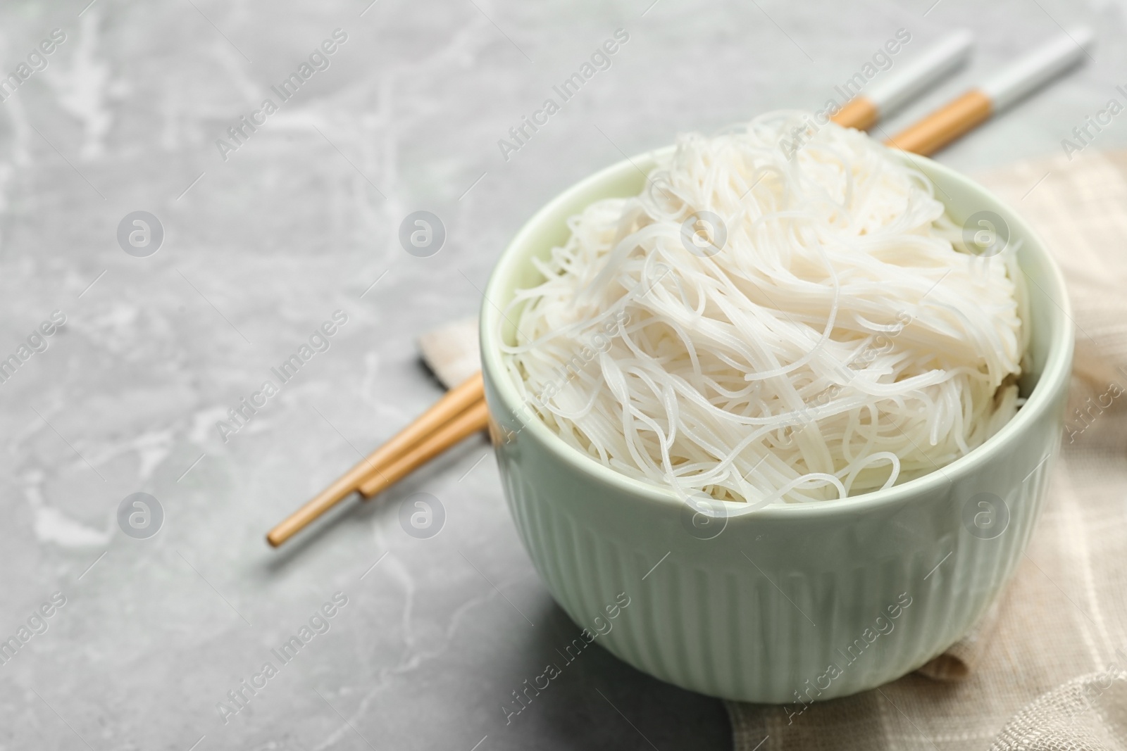 Photo of Rice noodles on light grey marble table