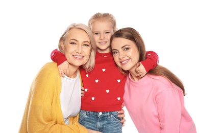 Photo of Portrait of young woman, her daughter and mature mother isolated on white