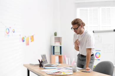 Photo of Professional interior designer at workplace in office