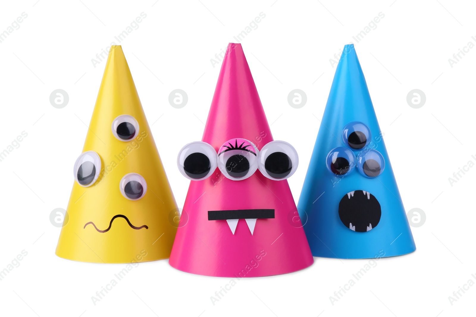 Photo of Funny handmade monsters isolated on white. Halloween decoration