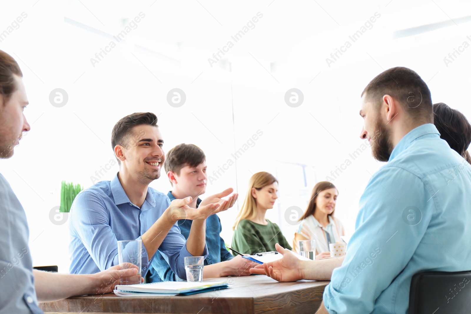 Photo of Young people having business training in office