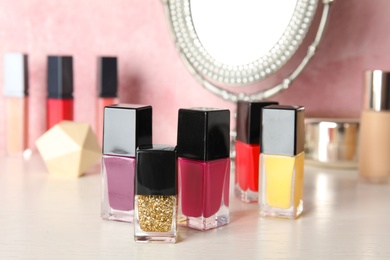 Photo of Bottles of nail polish on dressing table