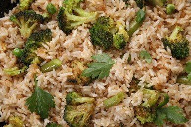 Photo of Tasty fried rice with vegetables as background, top view