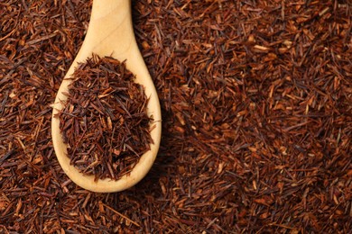 Photo of Rooibos tea and wooden spoon, top view