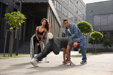 Group of people dancing hip hop outdoors