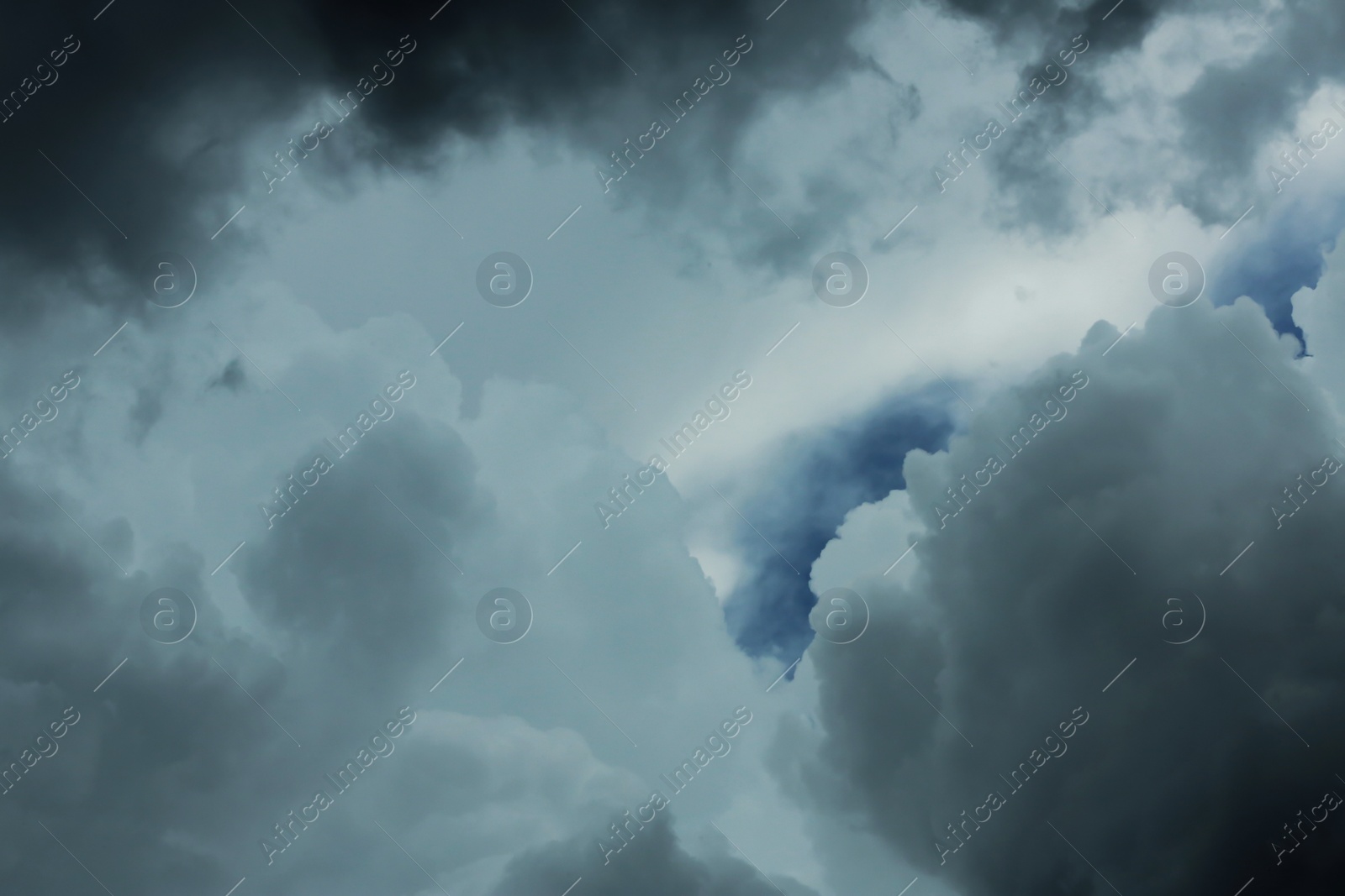 Photo of Sky with heavy rainy clouds on grey day