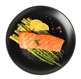 Photo of Tasty grilled salmon with asparagus, lemon and spices isolated on white, top view