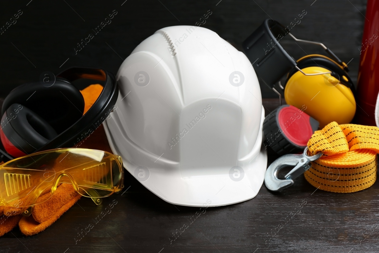 Photo of Composition with different safety equipment on table