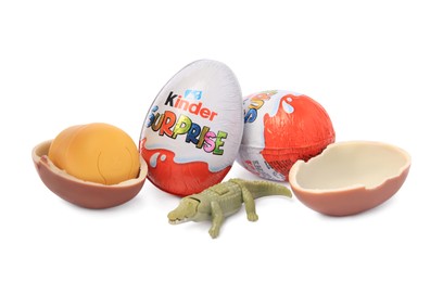 Slynchev Bryag, Bulgaria - May 24, 2023: Kinder Surprise Eggs, plastic capsule and toy crocodile isolated on white