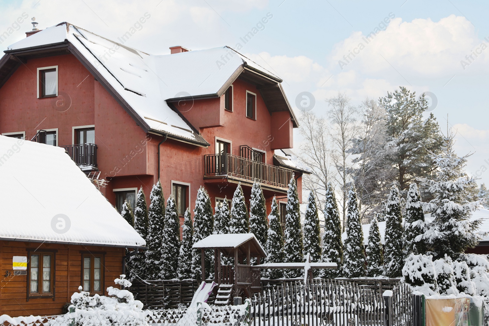 Photo of Modern hotel covered with snow in winter morning