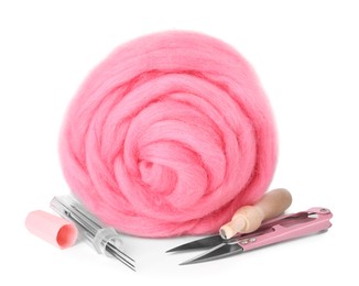 Photo of Pink felting wool, needles and scissors isolated on white