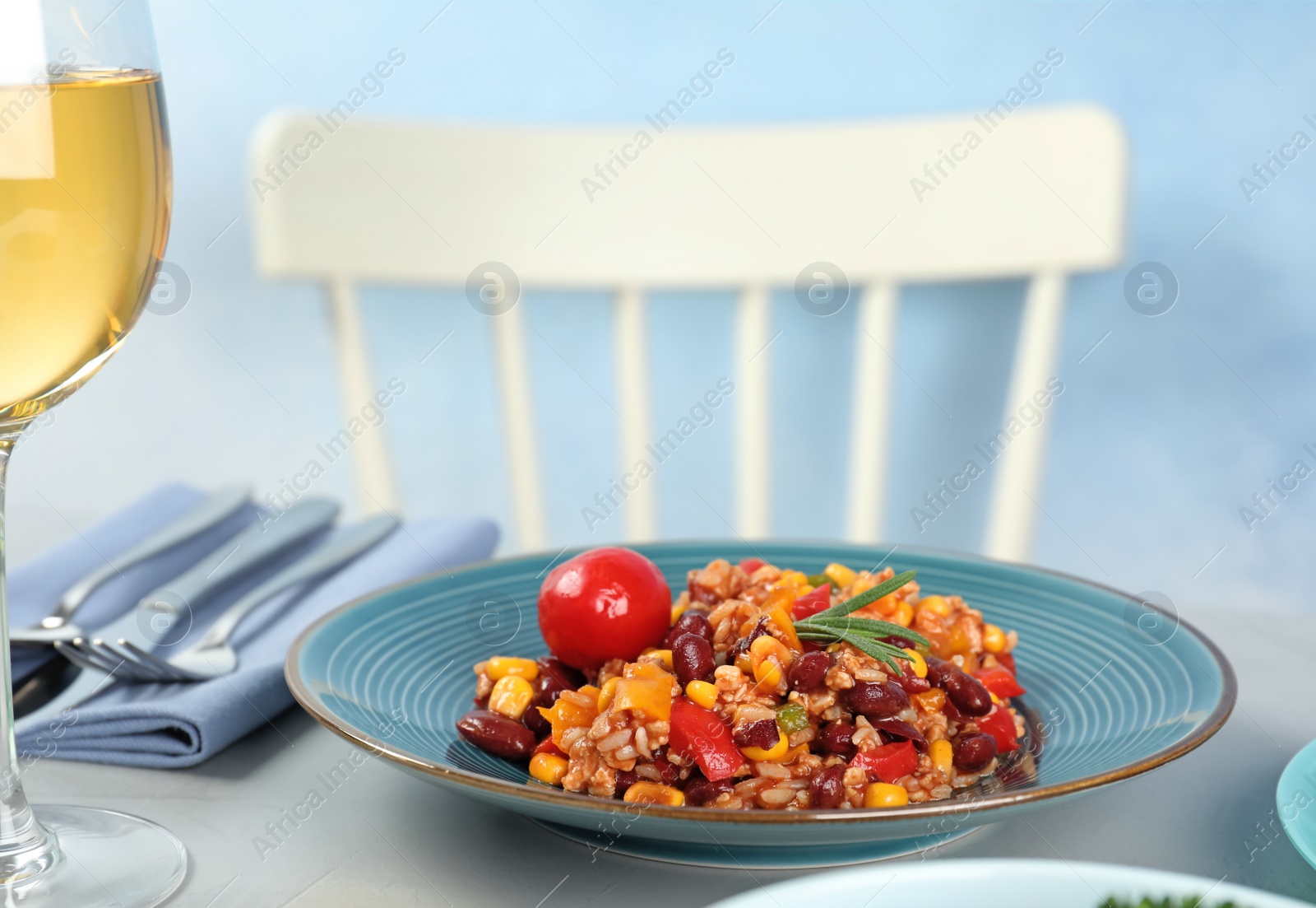 Photo of Plate with tasty chili con carne served on gray table