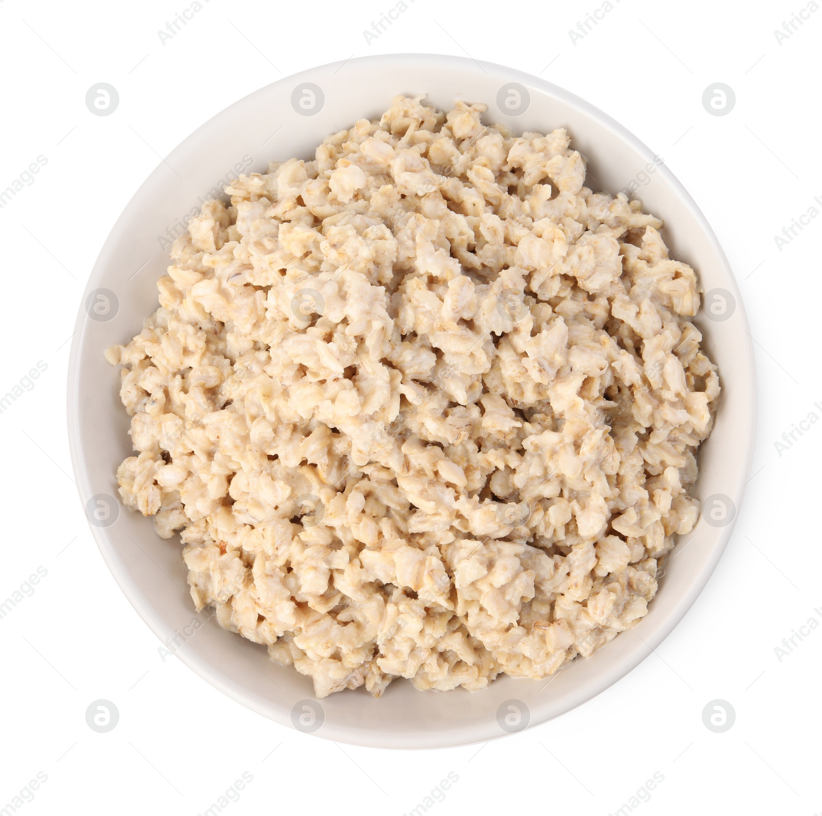 Photo of Tasty boiled oatmeal in bowl isolated on white, top view