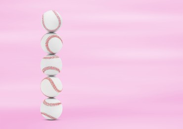 Image of Stack of baseball balls on pink background. Space for text