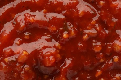 Texture of delicious adjika sauce as background, closeup