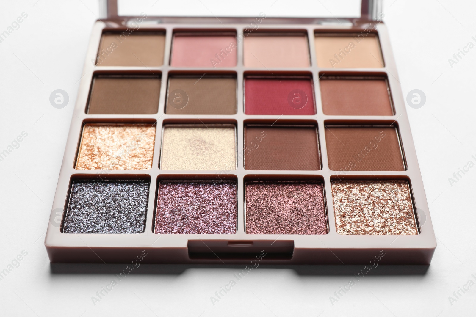 Photo of Beautiful eye shadow palette on white table, closeup