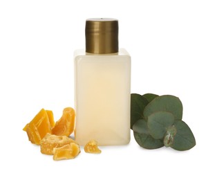 Photo of Bottle of cosmetic product, natural beeswax and eucalyptus on white background