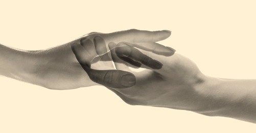 Image of Double exposure of people's hands on beige background, closeup. Sepia effect
