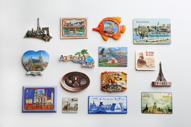 Photo of MYKOLAIV, UKRAINE - DECEMBER 24, 2018: Many different travel magnets on light background