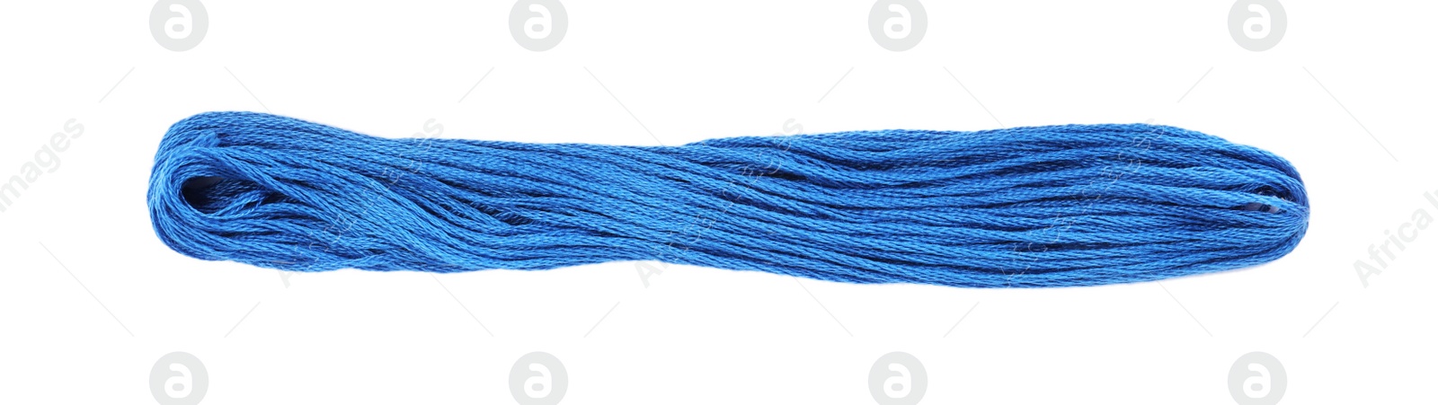 Photo of Bright blue embroidery thread on white background